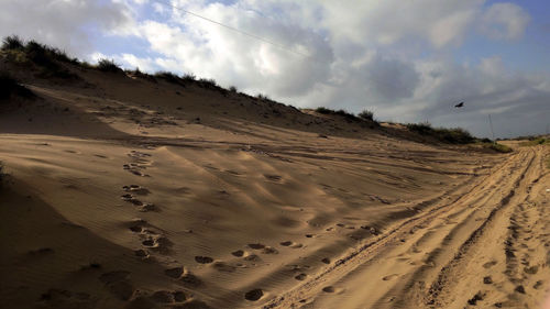 Panoramic view of desert against sky