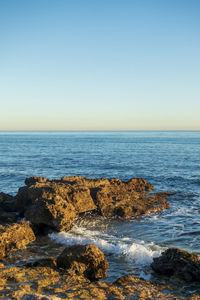 Scenic view of sea against clear sky