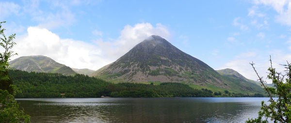 Scenic view of lake and mountains against sky