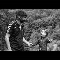 Full length of boy playing with arms raised