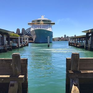 Pier over sea against blue sky