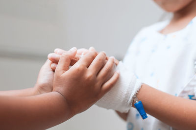 Close-up of hand holding hands