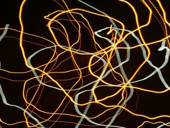 Low angle view of light trails at night