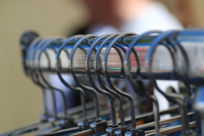 Close-up of coathangers on rack