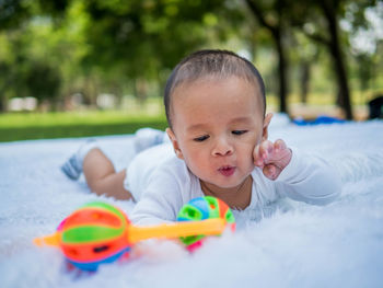 Cute boy playing with toy