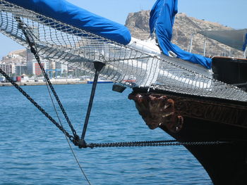 Close-up of boat moored in sea