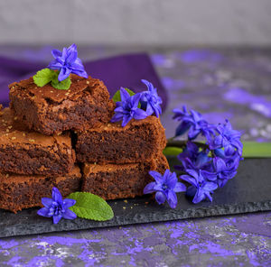 Close-up of sweet food with flowers on table