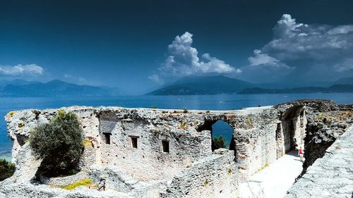 Panoramic view of sea and buildings against sky