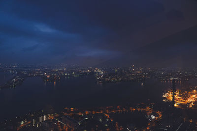 High angle view of illuminated buildings in city at night