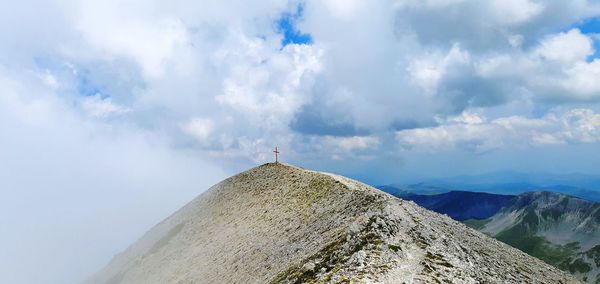 Low angle view of cross against sky