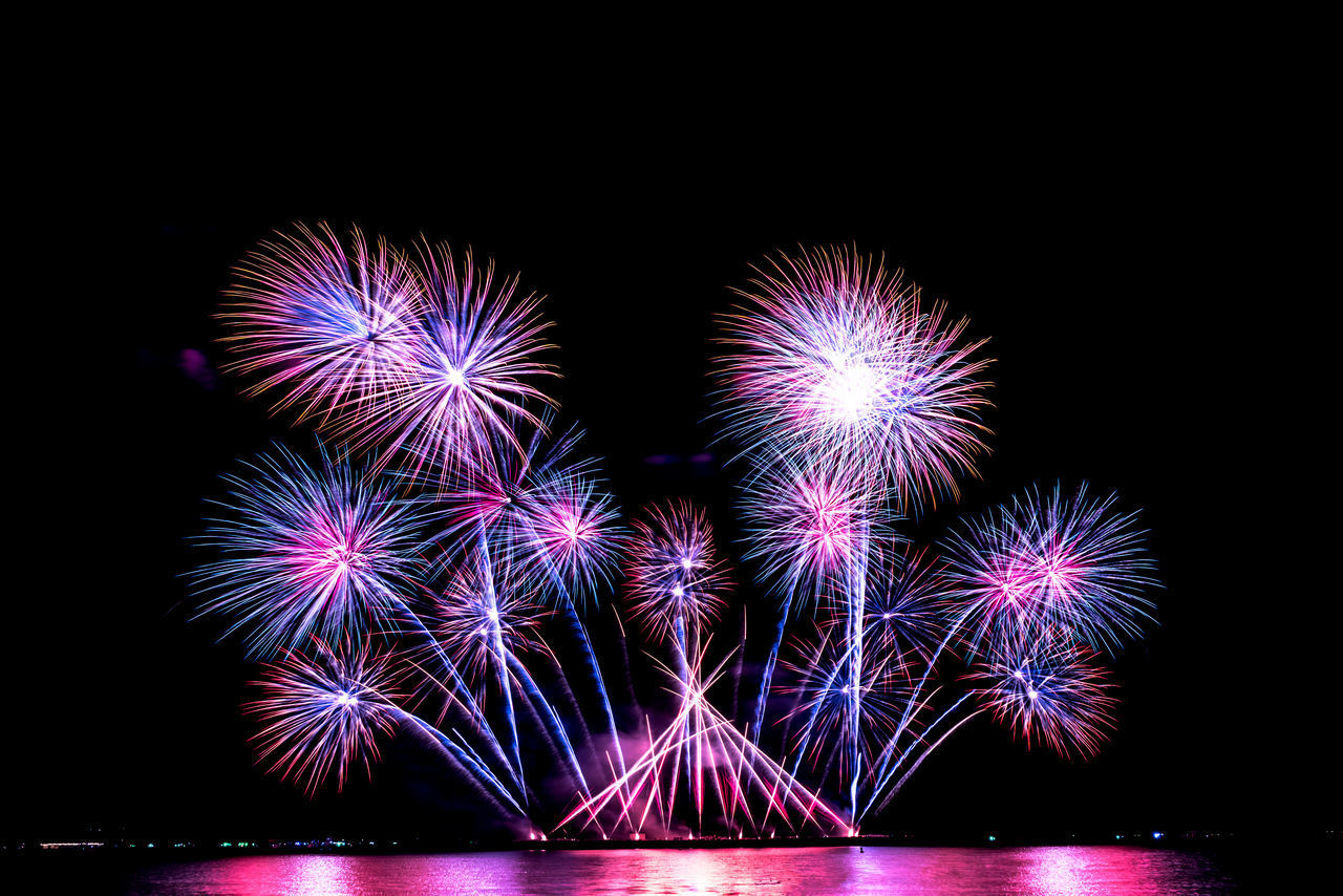 FIREWORK DISPLAY AGAINST SKY