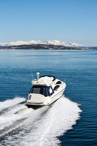 Sailboat on sea against clear sky