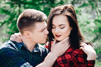 Loving young couple in forest