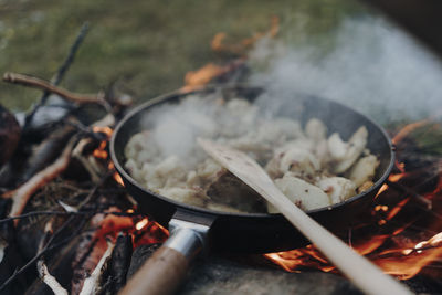 High angle view of meat on barbecue grill