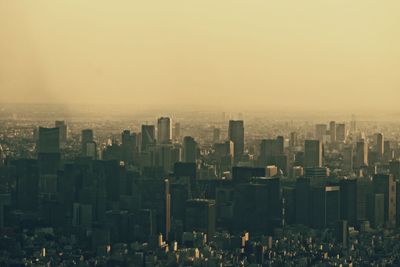 High angle view of modern buildings in city against sky