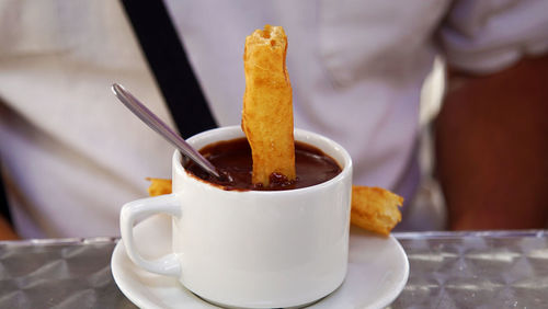 Close-up of coffee cup on table