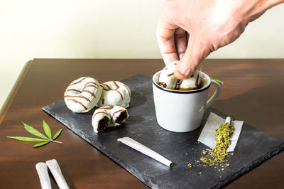 Close-up of person preparing food on table