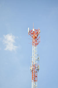 Low angle view of communications tower against sky