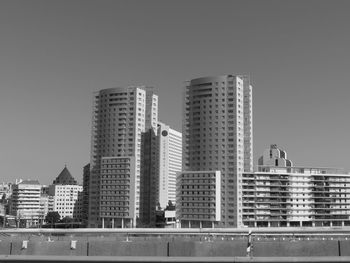 Low angle view of skyscrapers against clear sky