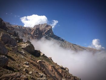 Majestic rocky mountain against blue sky