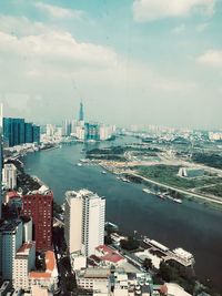 High angle view of buildings in city against sky