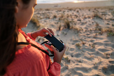 Midsection of woman using mobile phone