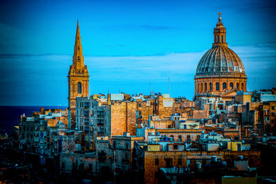 View of buildings in city against sky