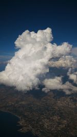 Scenic view of landscape against cloudy sky