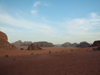 Scenic view of arid landscape against sky