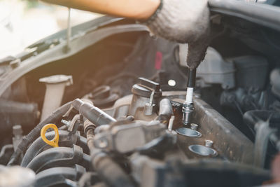 Close-up of person repairing car