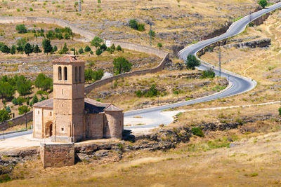 Built structure on landscape against mountain