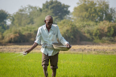 Full length of man standing on field