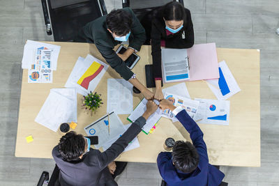 High angle view of people on table