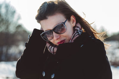 Portrait of young woman in sunglasses