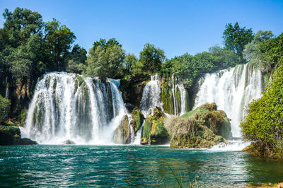 View of waterfall in forest