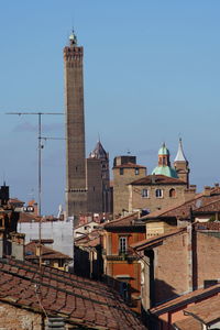 View of buildings in city against clear sky