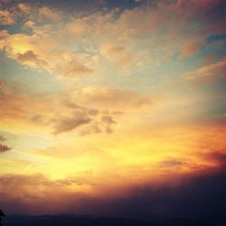 Scenic view of cloudy sky at sunset