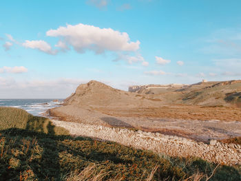 Scenic view of beach against sky