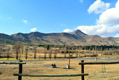 Scenic view of mountains against cloudy sky