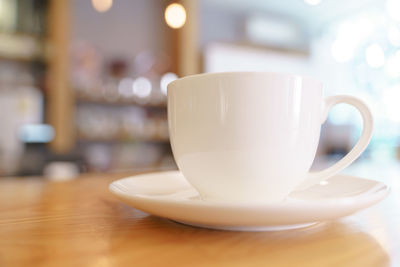 Close-up of coffee cup on table