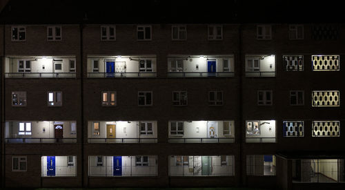 Reflection of illuminated building in city at night