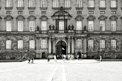 People in front of building