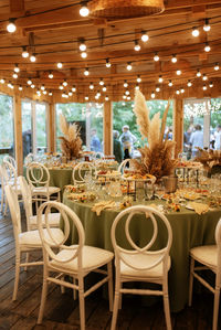 Empty chairs and tables in restaurant