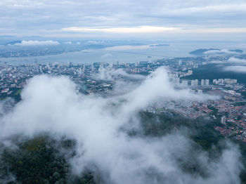 High angle view of buildings in city against sky