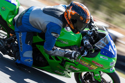 High angle view of man racing on motorcycle