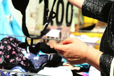 Cropped image of woman shopping bra