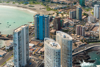 High angle view of buildings by swimming pool in city