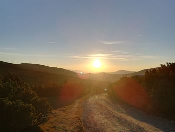 Scenic view of landscape against sky during sunset