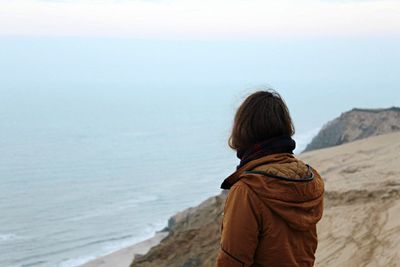 Rear view of woman looking at sea