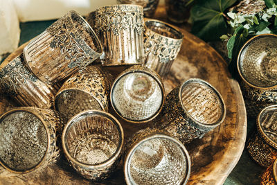 Glass vases in wooden bowl